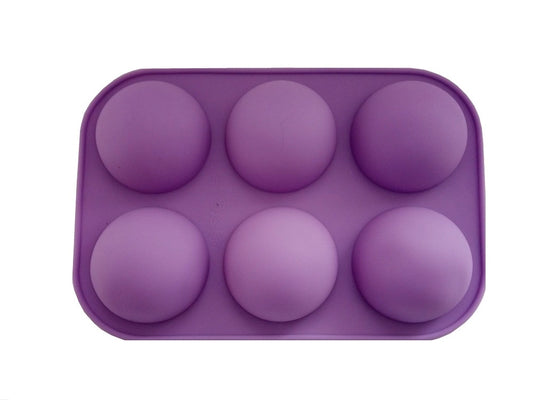 Violette Silikon Backform mit 6 Halbkugel Mulden für Pralinen oder Schokobomben.