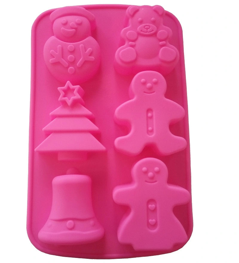 Pinke Silikon Backform mit 6 Weihnachtsmotiven: Schneemann, Teddybär, Weihnachtsbaum, Lebkuchenmann und Weihnachtsglocke.