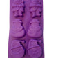 Lila Silikon-Backform mit 6 weihnachtlichen Motiven: 2 x Weihnachtsmann (Figur), 2 x Schneemann und 2 x Weihnachtsmann Kopf.